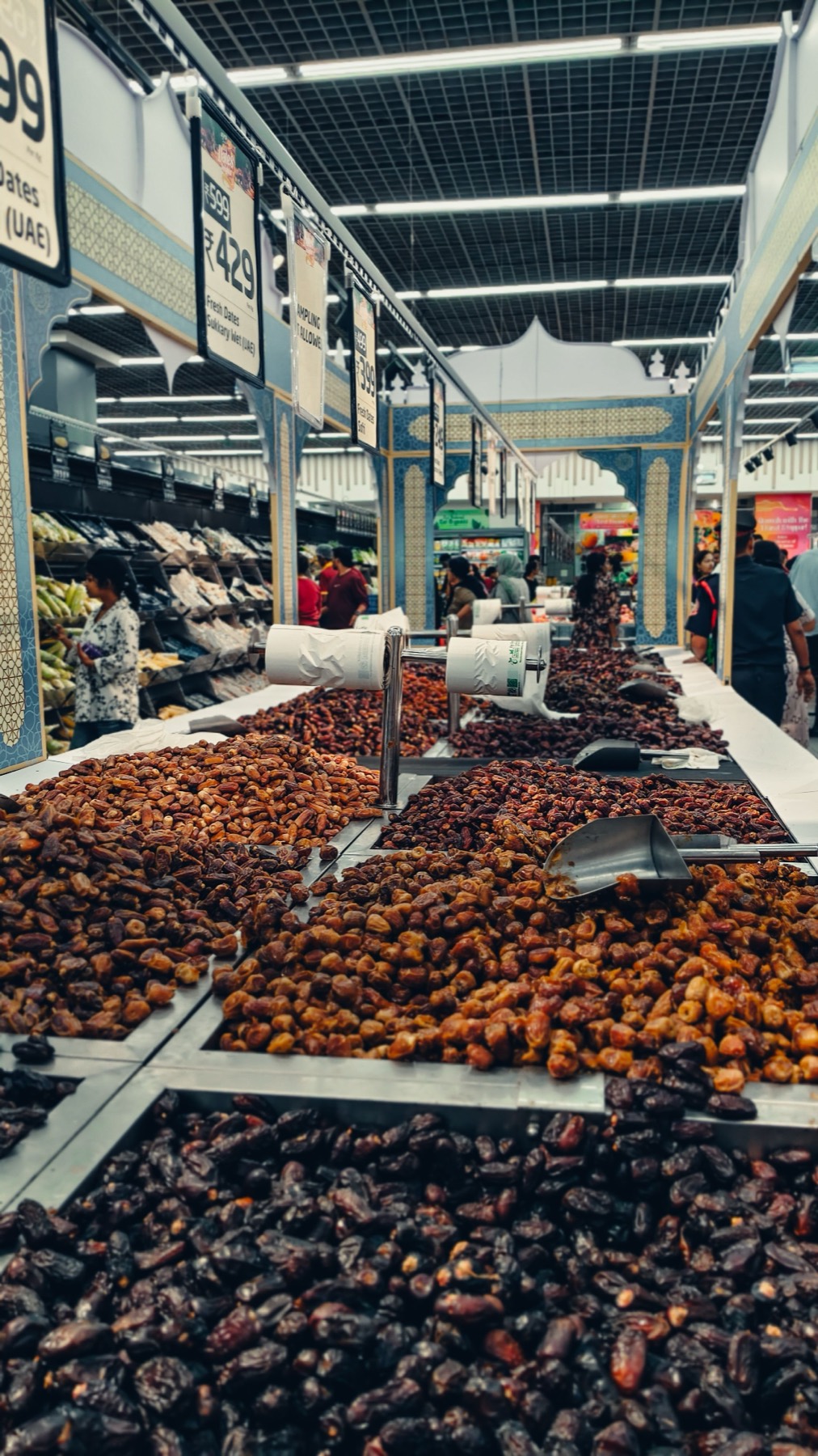 Bulk dates aisle with price signage at a UAE hypermarket
